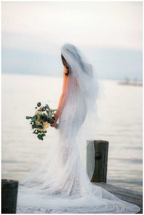 bridal photo with long veil on water