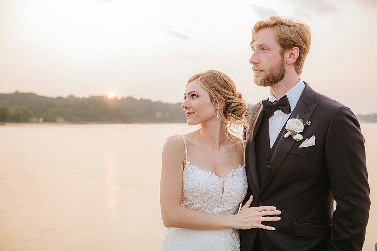 Herrington on the bay waterfront wedding black tux sunset