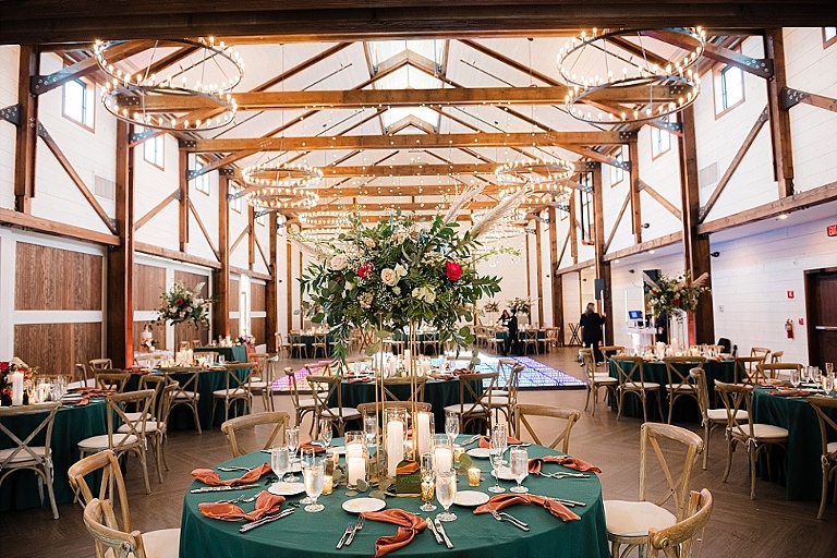 rich green, gold, and  copper colors wedding colors in elegant barn wedding at Kent Island Resort with light up dance floor